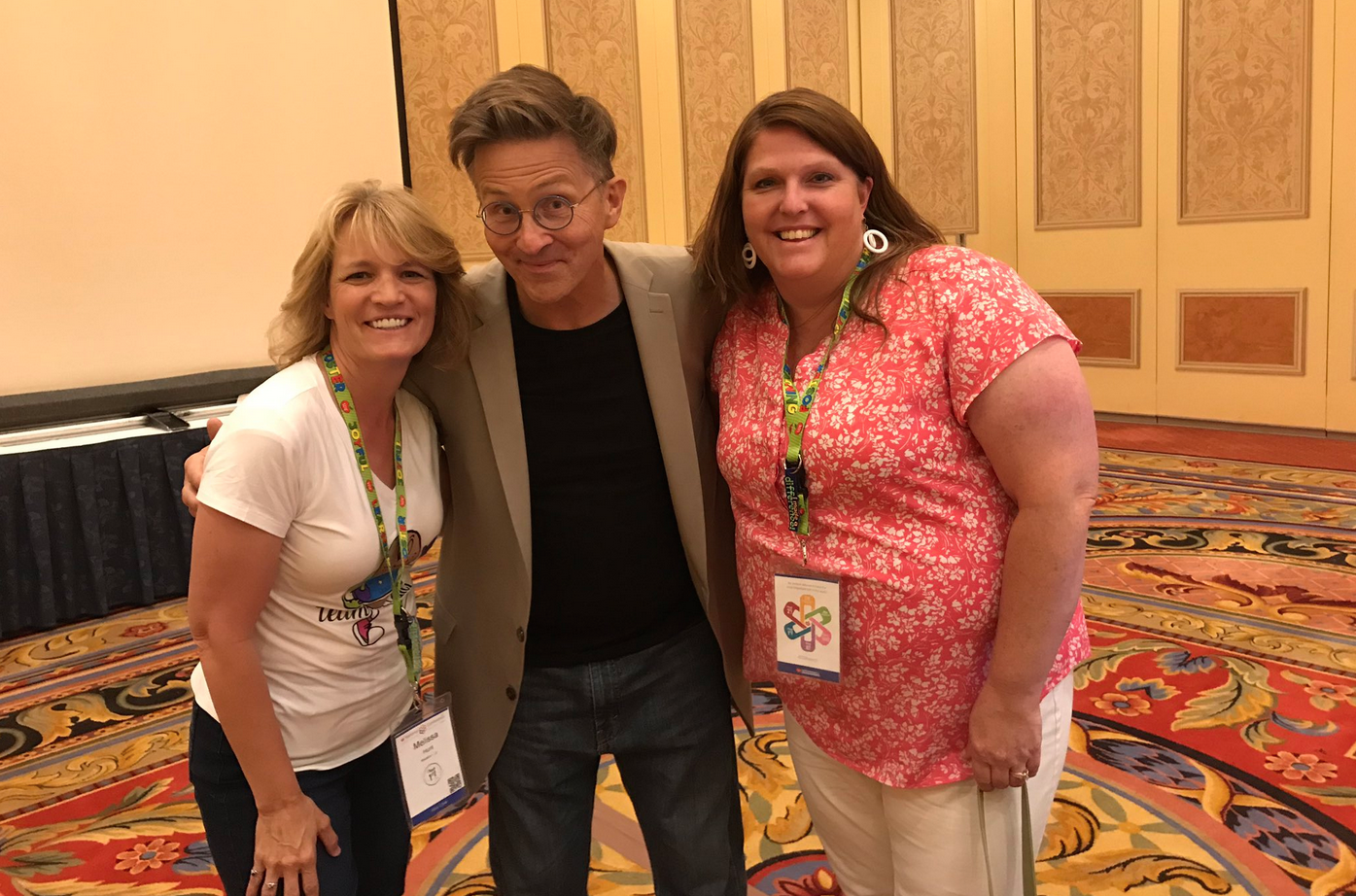 Tim Clue on stage at a national education conference